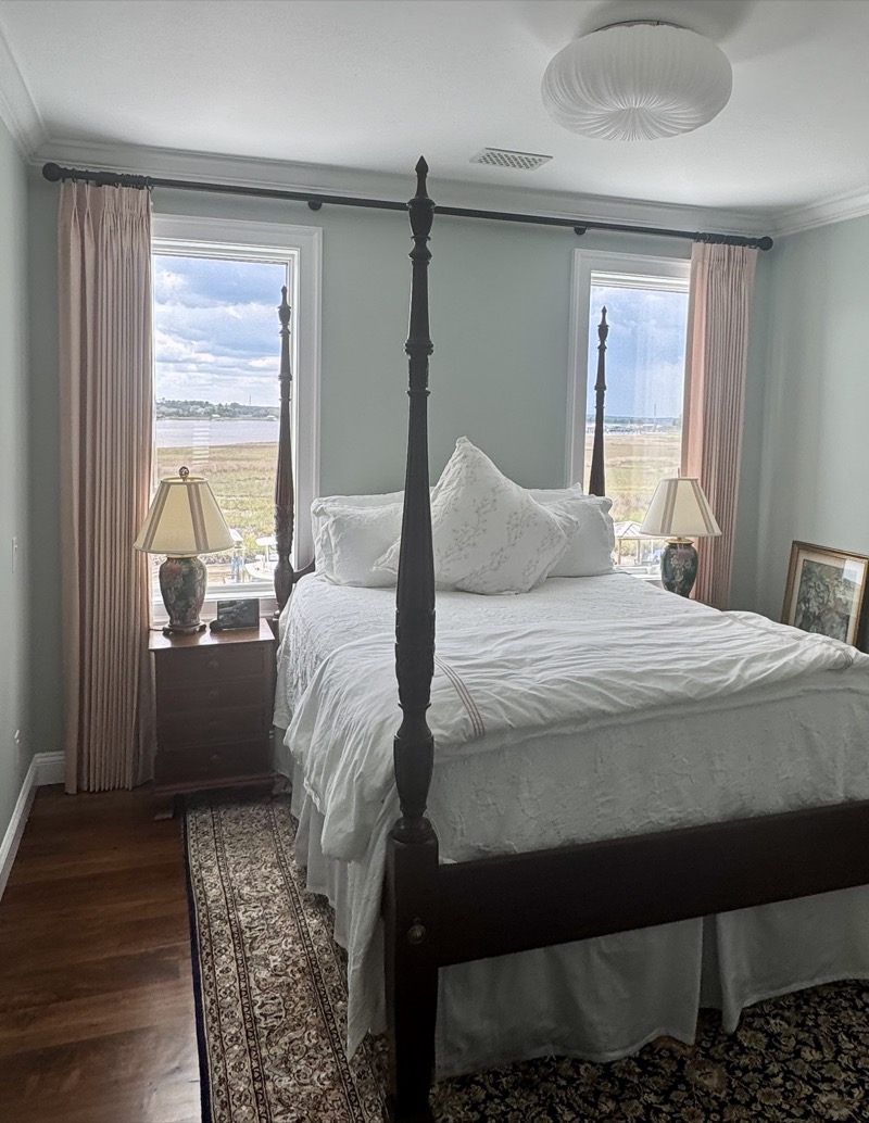 Custom drapery panels with elegant pleating in a Charleston living room