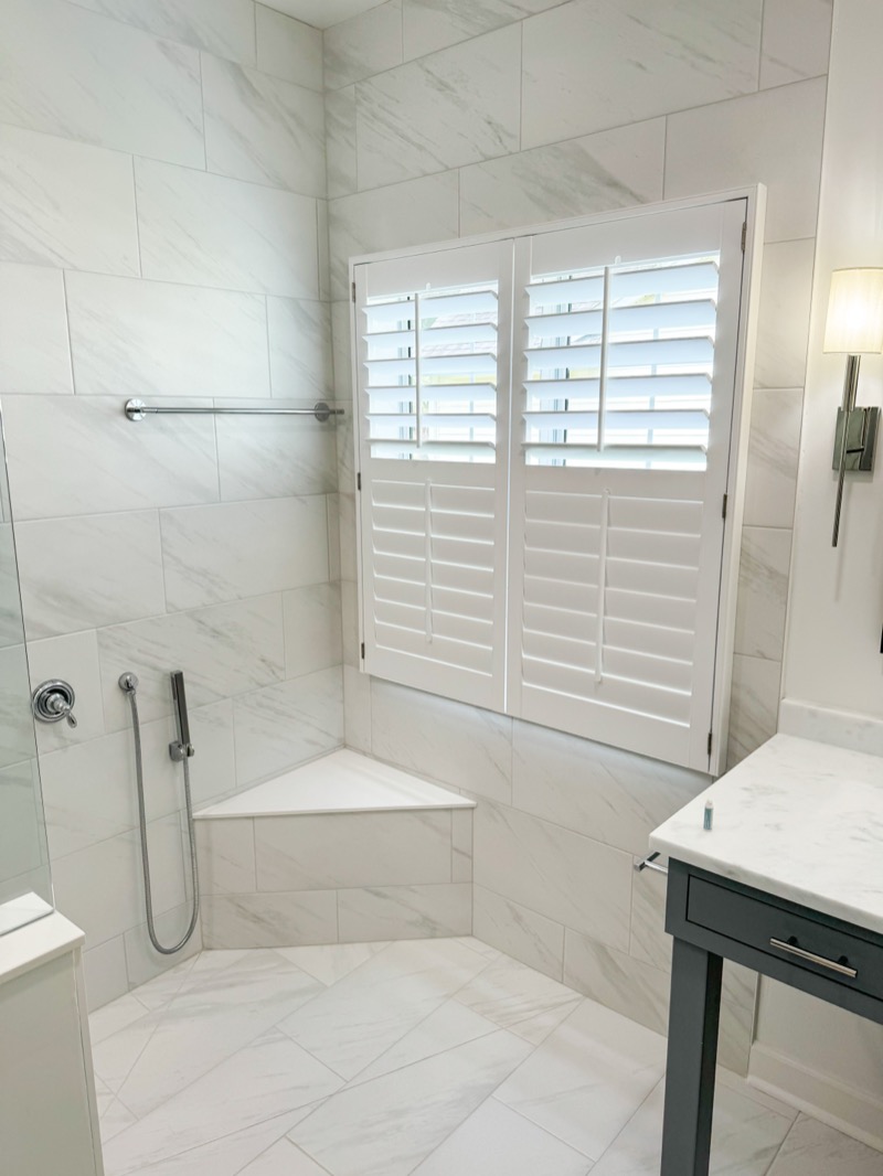 Moisture-resistant plantation shutters in a luxury Charleston bathroom