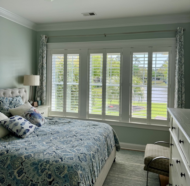 Custom plantation shutters with cafe-style louvers in a sunny Charleston kitchen